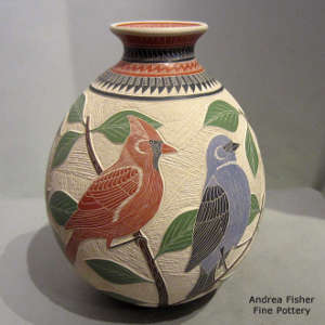 Sgraffito and painted branch, bird and geometric design on a polychrome jar
