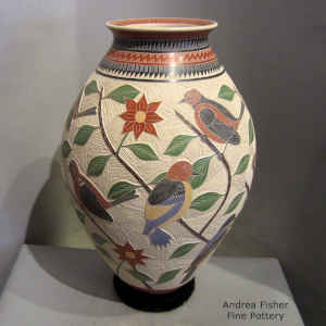 Sgraffito and painted bird, branch and geometric design on a polychrome jar