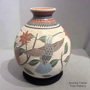 Sgraffito and painted bird, flower and geometric design on a polychrome jar