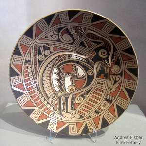 Feather and geometric design with a carved quail on a polychrome plate
