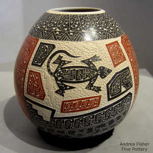 Sgraffito and painted lizard, bird and geometric design on a polychrome jar