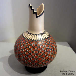 Rabbit and geometric design on a polychrome long neck jar with a kiva step opening