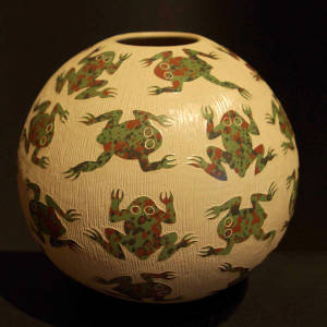 Sgraffito frog design on a polychrome jar