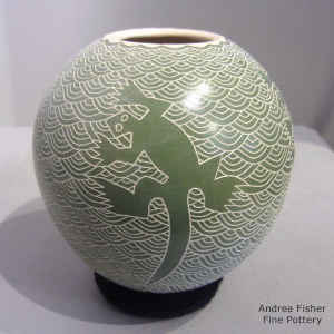 Green and white jar with sgraffito lizard and mesh design