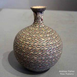 Geometric designs on a polychrome thin neck jar