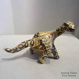 Geometric design on a polychrome dinosaur figure