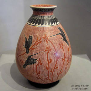 Paquime feather and geometric designs around the neck of a polychrome jar decorated with a hummingbird, lizard and flower motif