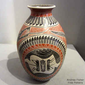 Polychrome jar decorated with a sgraffito and painted grasshopper, serpent, feather and geometric  design