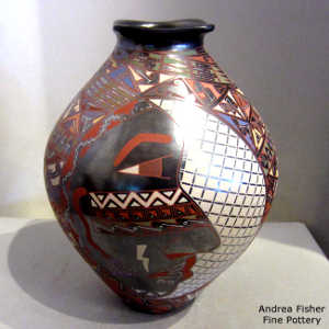 Aztec motif on a black jar with a square opening