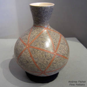 Fine line geometric design decorates a polychrome vase