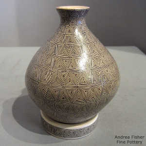 Geometric design on a polychrome vase with matching stand