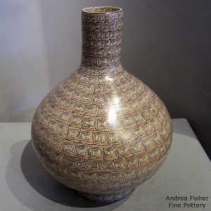 Geometric design on a polychrome vase with matching stand