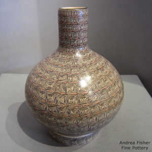 Geometric design on a polychrome vase with matching stand