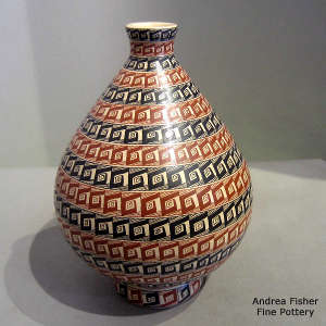 Bands of geometric design on a polychrome thin neck jar with matching stand