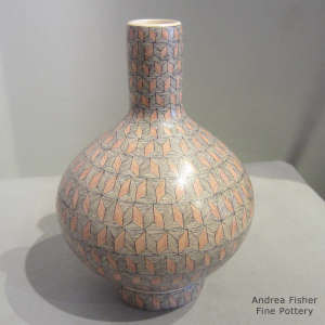 Geometric design on a polychrome thin neck jar with matching stand