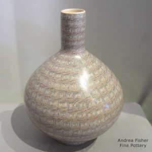 Bands of geometric design on a polychrome jar with a custom stand