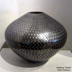 Textured surface on a polished black jar