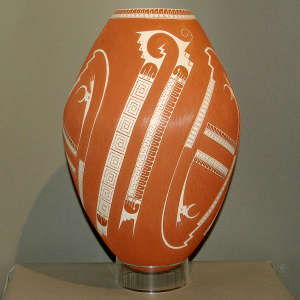 White geometric design on a tall red jar
