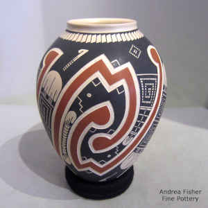 Lightly carved, sgraffito and painted geometric design on a polychrome vase