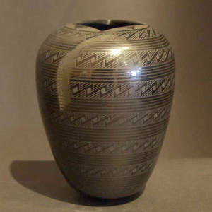 Bands of geometric design on a black on black jar