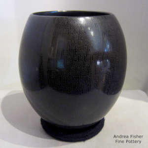 Geometric design on a black on black jar