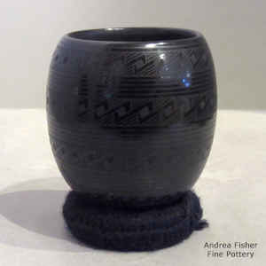 A geometric design on a black on black jar