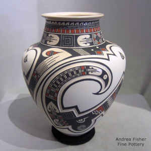 Lightly carved and painted geometric design on a polychrome vase