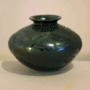 Ancient Paquime geometric designs decorate a black on black jar