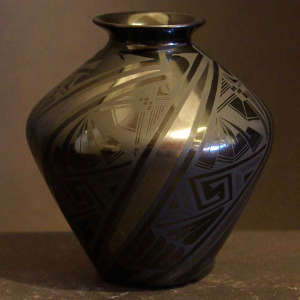 Geometric designs on a black on black jar