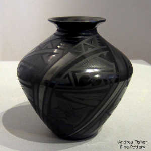 Bird element and geometric design on a black on black jar