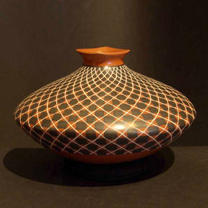 Swirl checkerboard design on a red and black jar