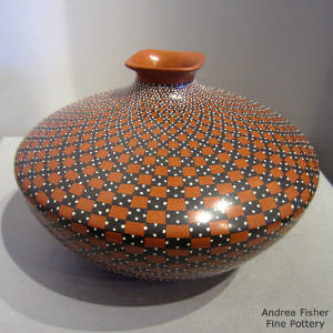 Geometric design and a square opening on a polychrome jar