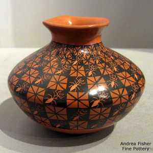 Cuadrillos geometric design and sgraffito ants on a red and black jar with a square rim