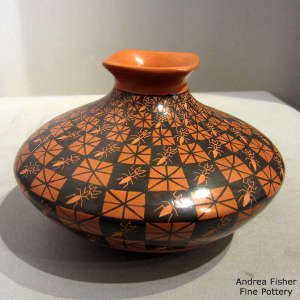 A painted cuadrillos geometric design with sgraffito ants on a polychrome jar