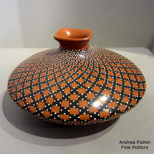 Squarish lip and cuadrillos geometric design on a polychrome jar