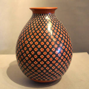 Geometric design on a narrow neck polychrome jar