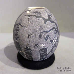 Sgraffito Night of the Dead motif on a black and white jar