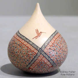 Miniature lidded tear drop jar with a hummingbid and geometric design