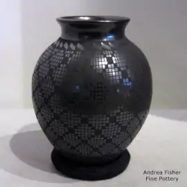 Geometric design on a black on black jar