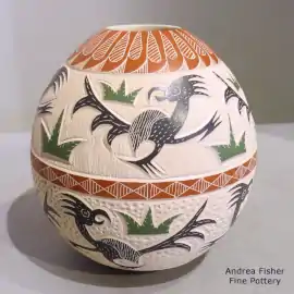 A sgraffito and painted bird, cactus and geometric design on a polychrome jar