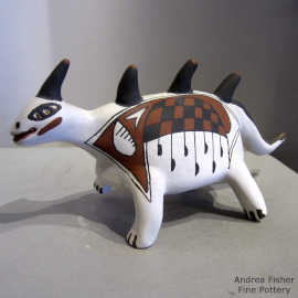 Geometric design on a polychrome dinosaur figure