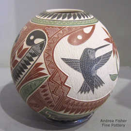 Polychrome jar with a lightly carved, sgraffito and painted bird, lizard, bee and geometric design