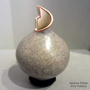 Polychrome vase with a kiva step cut neck and a geometric design