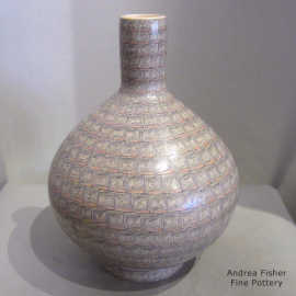 Polychrome vase with a geometric design and matching custom stand