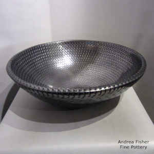Corrugated surface on a large black bowl