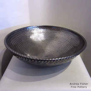Corrugated surface on a large black bowl