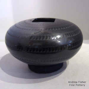 A geometric design on a black on black jar