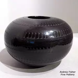Geometric design on a black-on-black jar