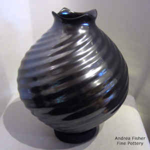 Squarish rim on a black jar with formed spiral ribs