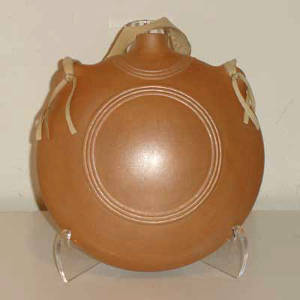 Leather strap on a micaceous clay canteen